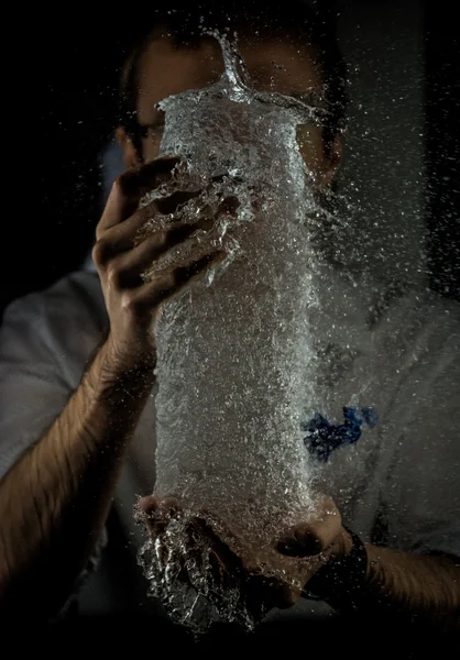High- Speed, Slow Motion Water Explosion in Hands