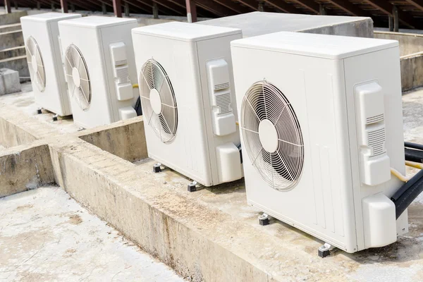 Air compressors machine on roof of industrial building