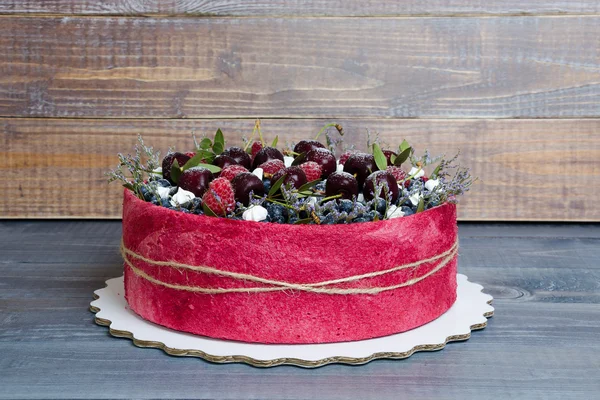 Rose wedding biscuit fruit cake with berries and some green