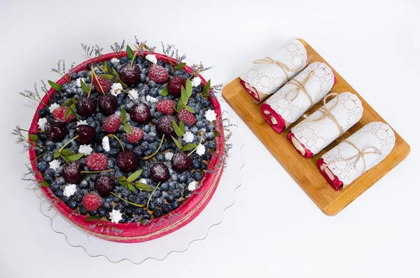 Rose wedding biscuit fruit cake with berries and some green