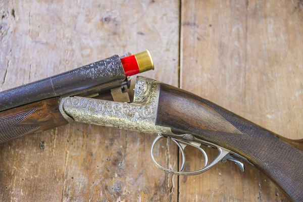 Vintage hunting gun with shotgun shell