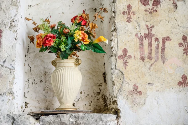 Old vase with flowers in England