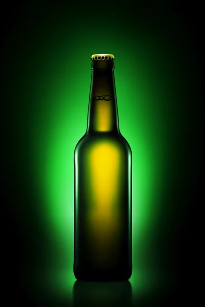 Bottle of beer in brown bottle with clipping path on green gradient background