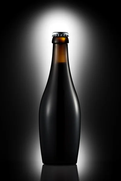 Bottle of dark beer with clipping path on black gradient background