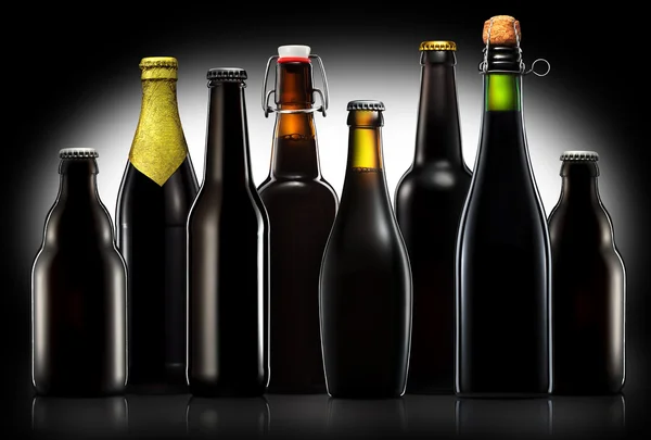 Set of beer bottles isolated on black background