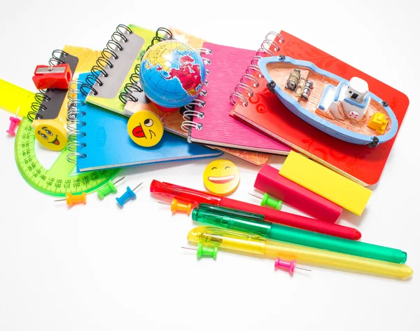 Pens, pencils, erasers with emoticons, a set of notebooks