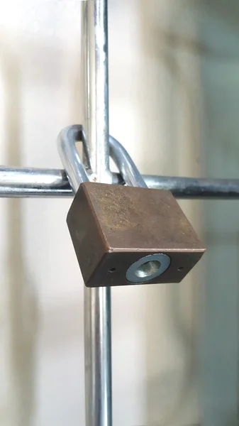 Padlock on a gate, security and protection