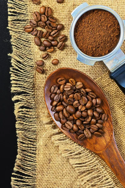 Grains of coffee on a jute background. Ground coffee