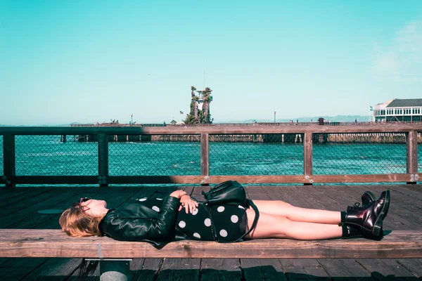 Girl Lying Down on a Bench at San Francisco, California