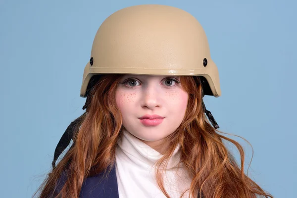 Red-haired girl in the military helmet