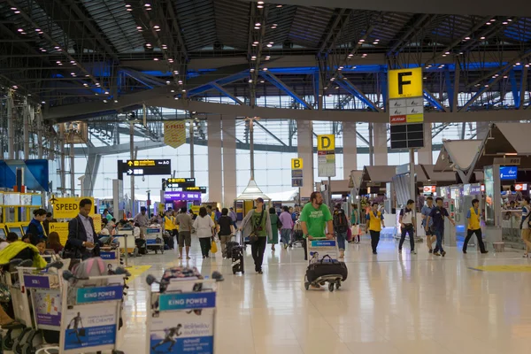 Passengers and workers in the departure terminal of Bangkok Suvarnabhumi Airport, Thailand