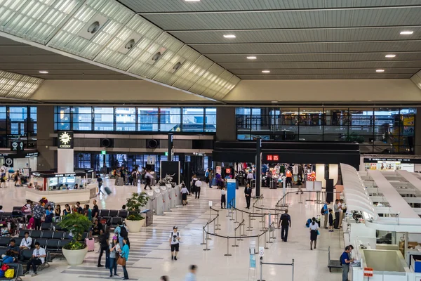 Passengers checking in at terminal 2 departure area at Narita International Airport, Tokyo, Japan.