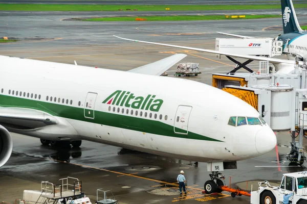 Alitalia aircraft Boeing 777 towed at Narita International Airport, Japan
