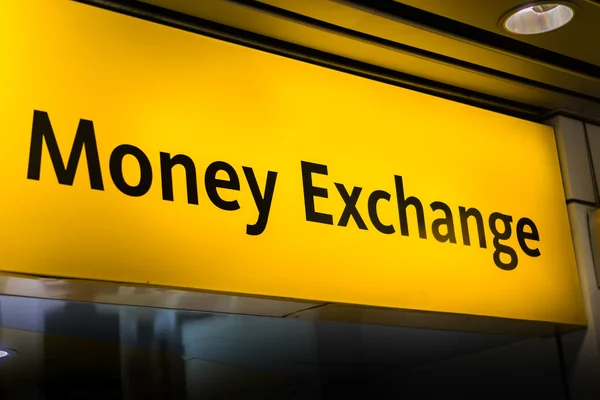 Money exchange / currency exchange sign board at airport