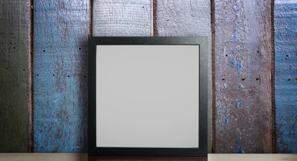 Blank Thick Photo frame on rustic wooden background.