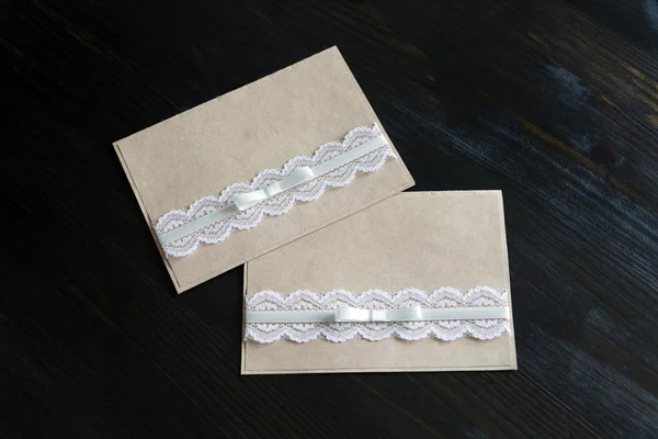 Handmade card from kraft paper with lace and bow