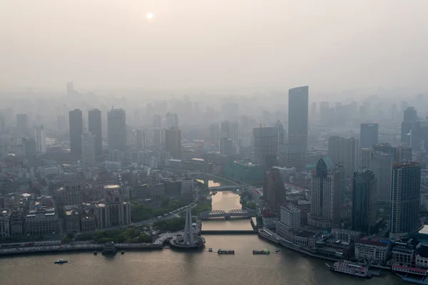 Modern city in a pollution at sunset (Shanghai, China)