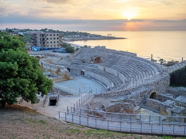 Roman amphitheater and Mediterranean Sea at sunset in Tarragona , Catalonia, Spain