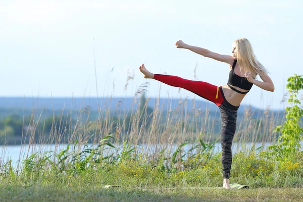 Young beautiful woman squats shows result press on stomach workout training wearing top