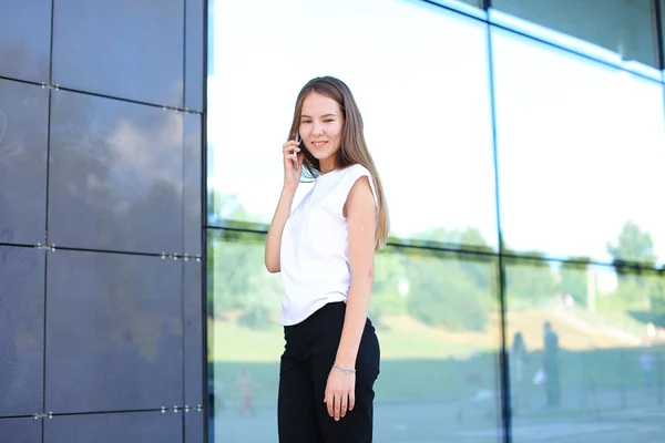 Business woman work near center speaks on phone