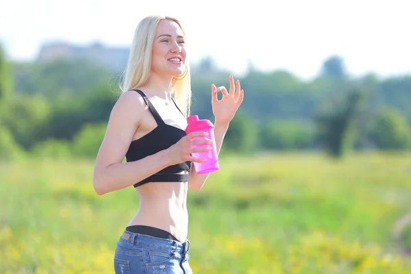 Young beautiful woman sport shows press on the stomach workout training results.