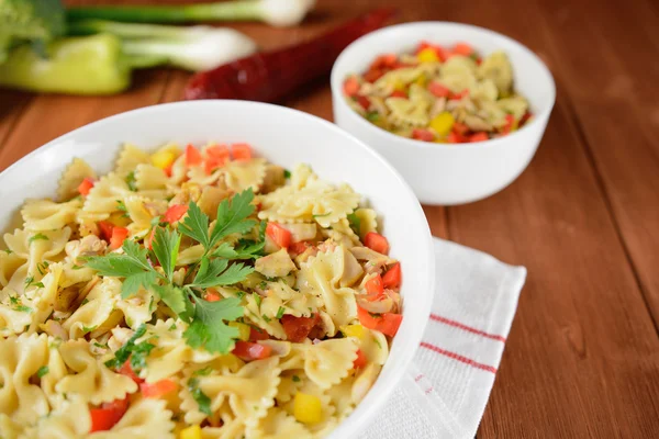 Pasta salad with chicken meat and pepper