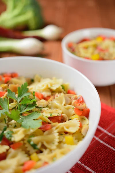 Pasta salad with chicken meat and pepper