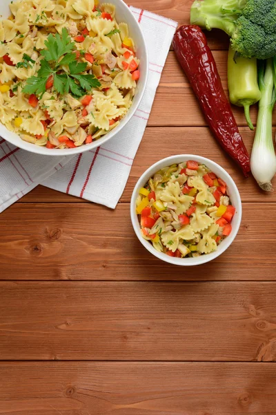 Pasta salad with chicken meat and pepper