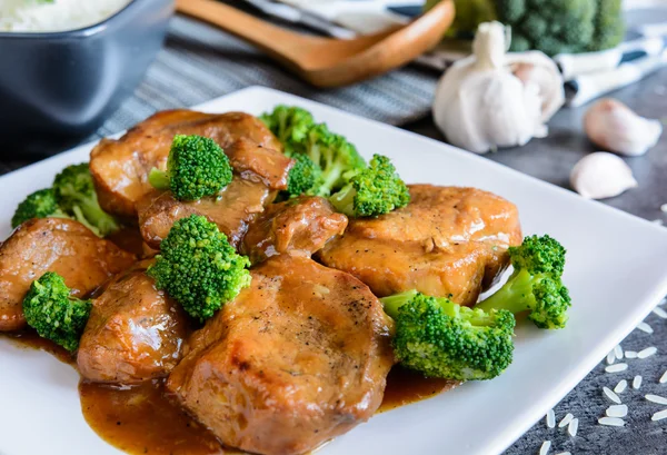 Steamed pork with balsamic vinegar and roasted broccoli and rice