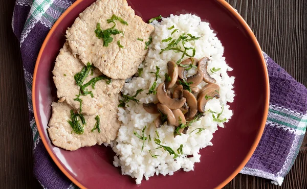 Pork loin fillets with rice and mushrooms