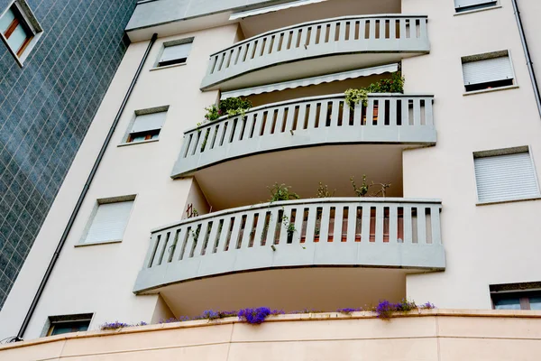 ITALY  Green Building with balconies lined for offices and homes. fragment green balcony in a building