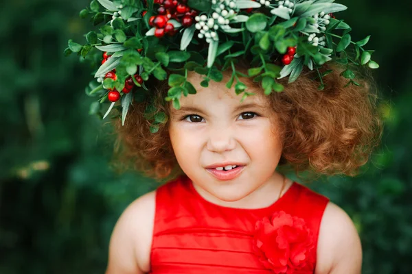 girl with flower with berry wreath