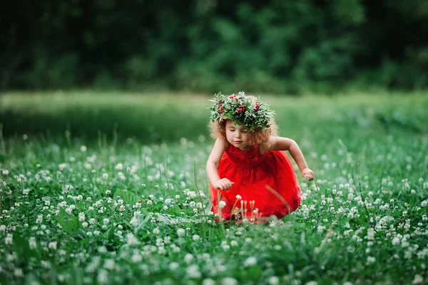 girl with flower with berry wreath