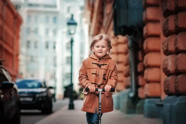 Little boy on a walk in city