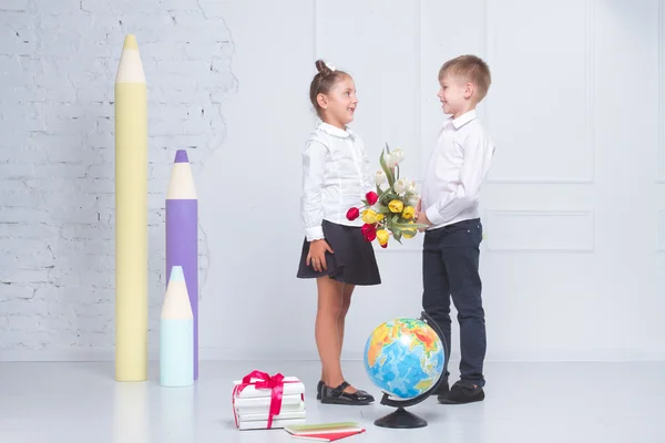 Student gives tulips to his girlfriend on the day of knowledge