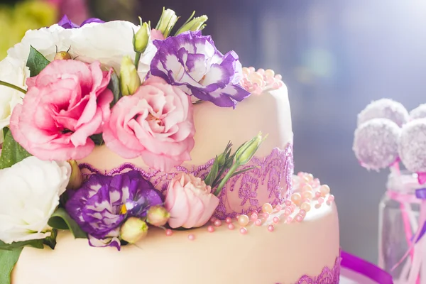 Cake is ivory color with flowers