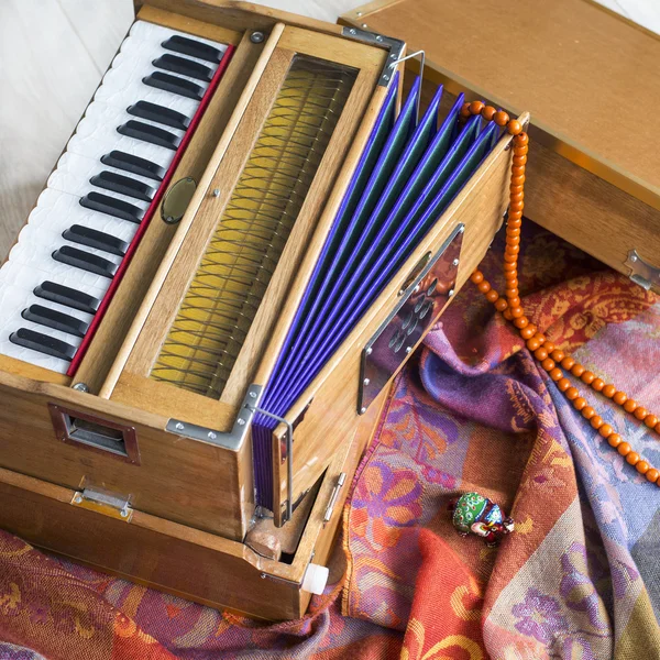 Indian harmonium, a traditional wooden keyboard instrument, close-up