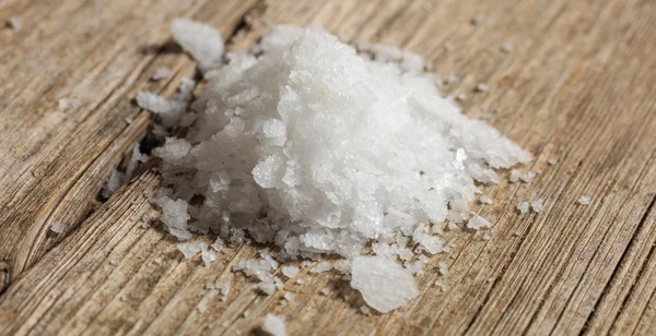 White salt on a wooden table