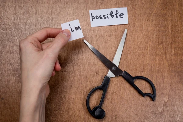 Scissors cutting negative label, self motivation concept