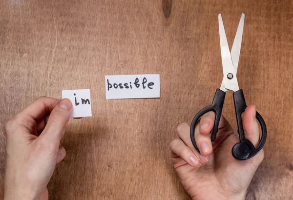 Scissors cutting negative label, self motivation concept