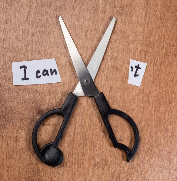 Self motivation concept. Scissors and the phrase I can\'t