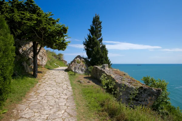 Footpath along rock and cliffs by the sea