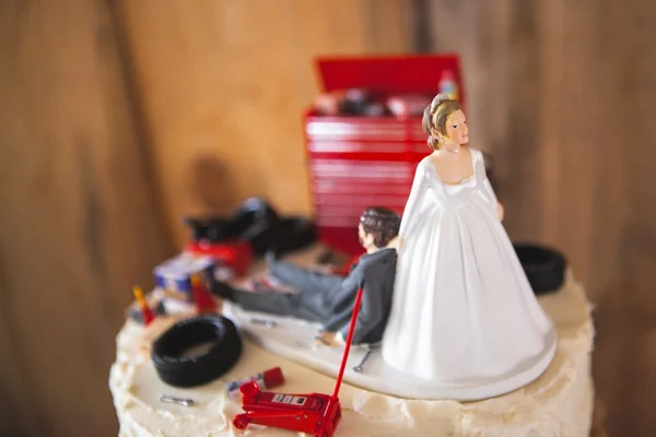 Redneck or mechanic wedding cake topper at angle