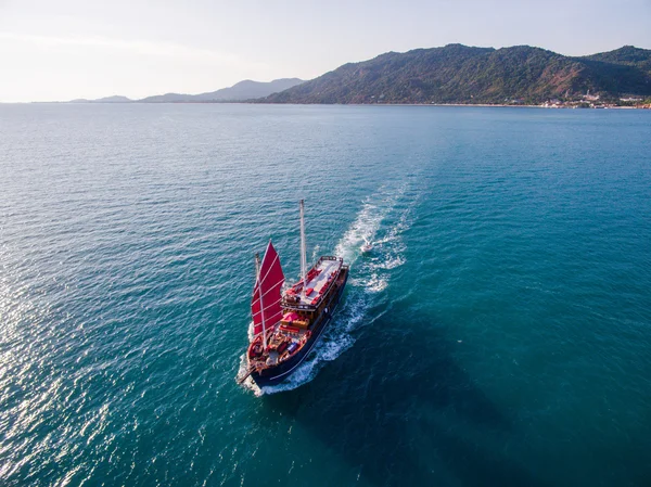 Aerial view red sailing ship is coming by the sea