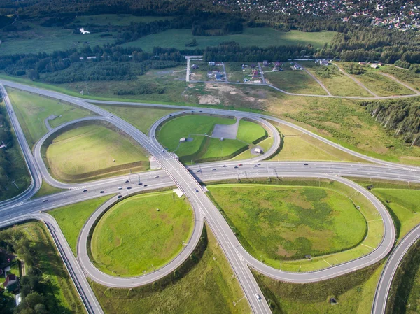 Road junction in the countryside aerial view  in the form of butterfly