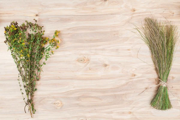 Minimal flower composition of the plants at wooden desk