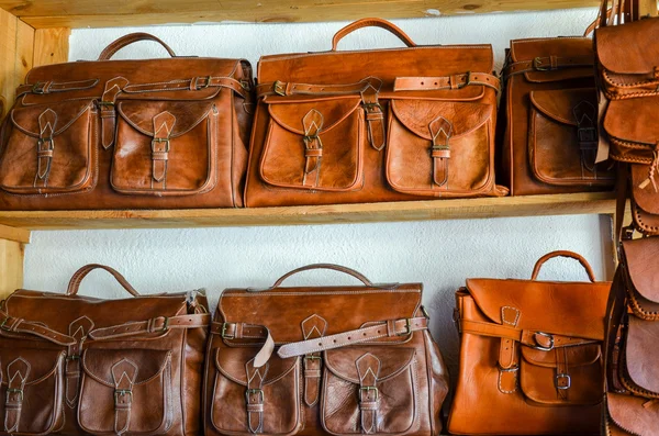 FEZ, MOROCCO, MAY 31, 2012- Vintage handmade leather bags sold in medina of Fez, Morocco