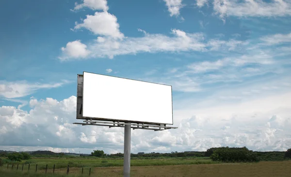 Empty billboard in front of beautiful cloudy sky in a rural location