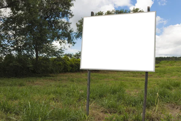 Empty billboard in front of beautiful cloudy sky in a rural location