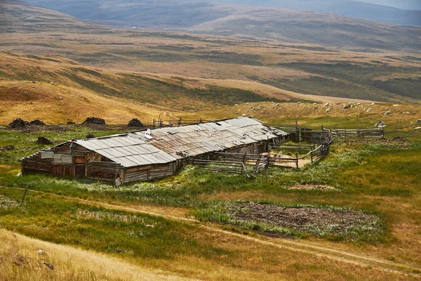 The Altai mountains, plateau Ukok. The pristine nature of the region. Abandoned farm in the mountains.